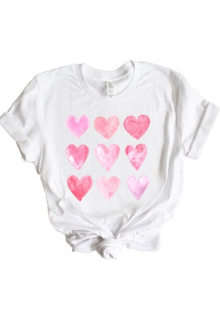 White t-shirt with pink heart designs 