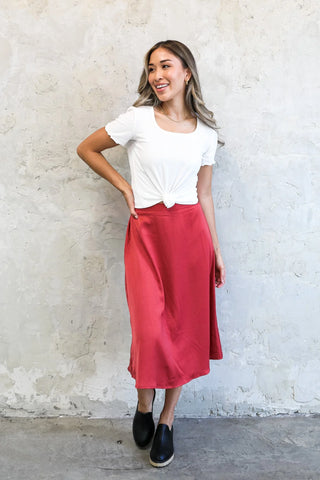 Red silk skirt with white tee 