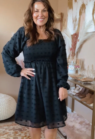 Midi length black dress