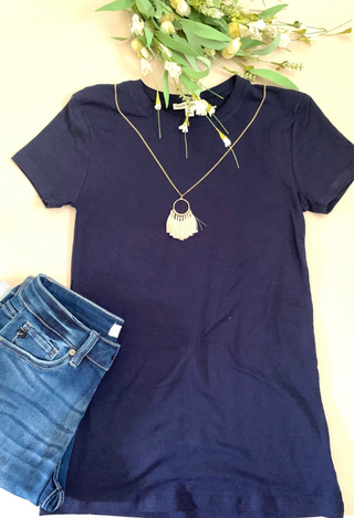 navy tee flat lay
