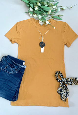 Ash mustard tee flatlay with jeans