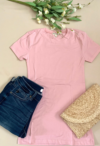 pink t shirt with jeans flatlay