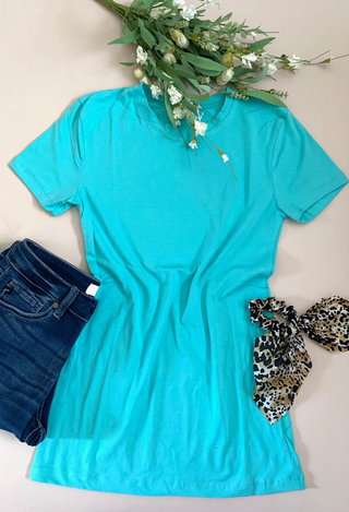 dark teal tee flatlay with jeans