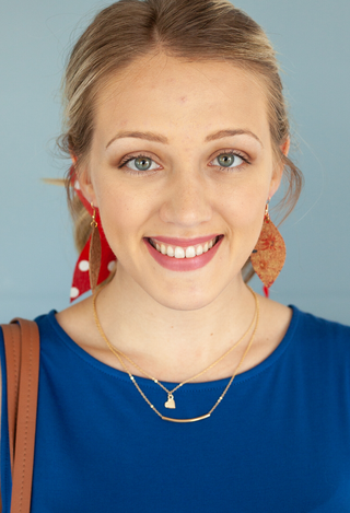 We are family necklace on blue top