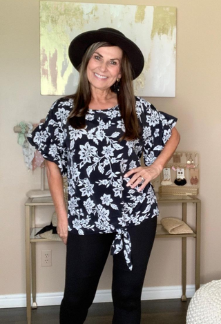 Gabby Downtown Top with black jeans and hat