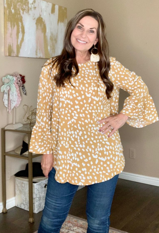 Geo Dressy Blouse with fringe earrings and jeans