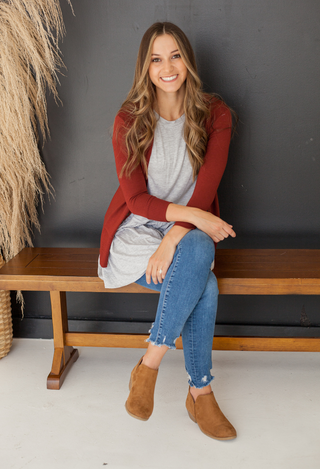 grey kacie top with brick sweater and jeans