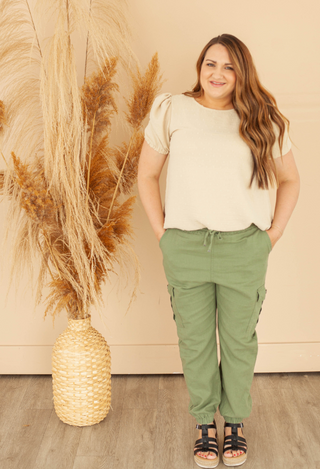 Olive pants with cream top