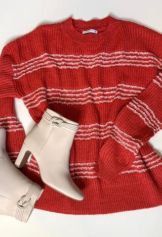 Nettie boots flatlay with red sweater