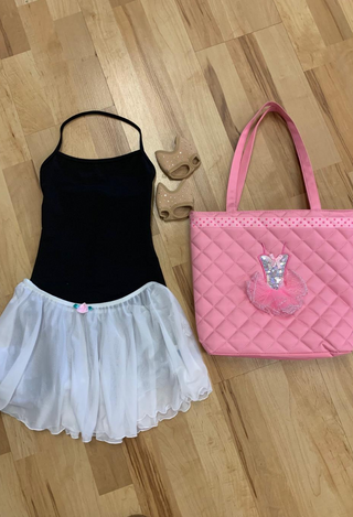 black top, white skirt and pink dance bag
