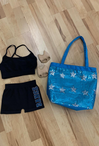 girls black strap sports bra, black dance shorts, turquoise sequin bag