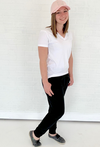 black Joggers with white tee, pink hat