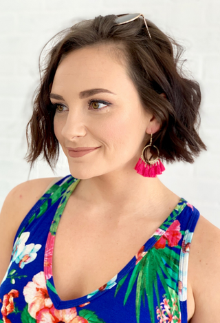 blue hawaiin dress with pink earrings