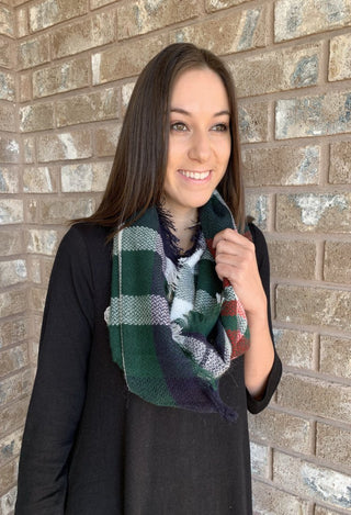 plaid scarf on black dress