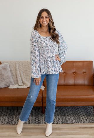 Blue floral top with jeans & cream boots